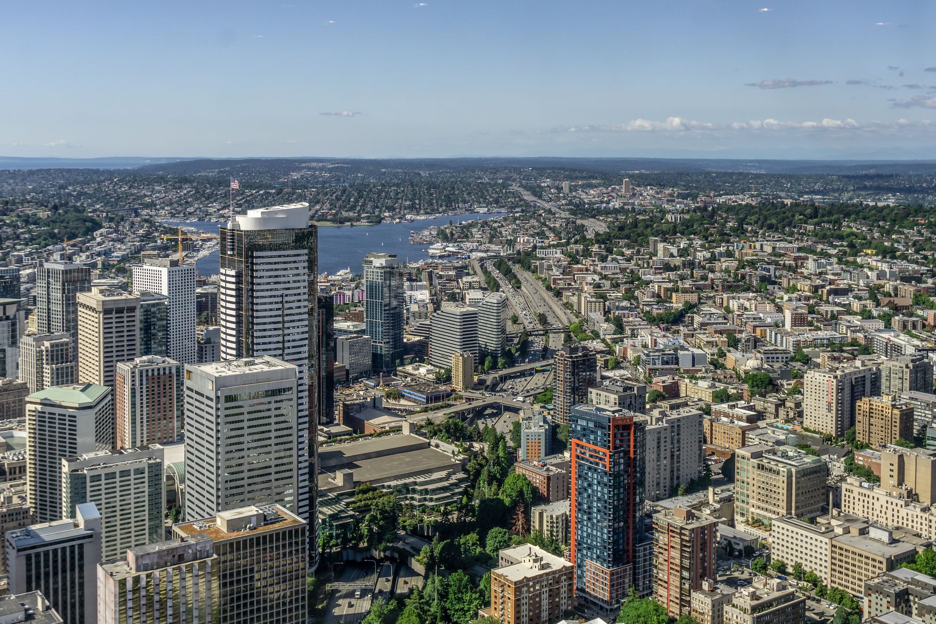 An aerial view of a city with lots of buildings and trees.