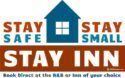 A logo for a small hotel called stay inn.