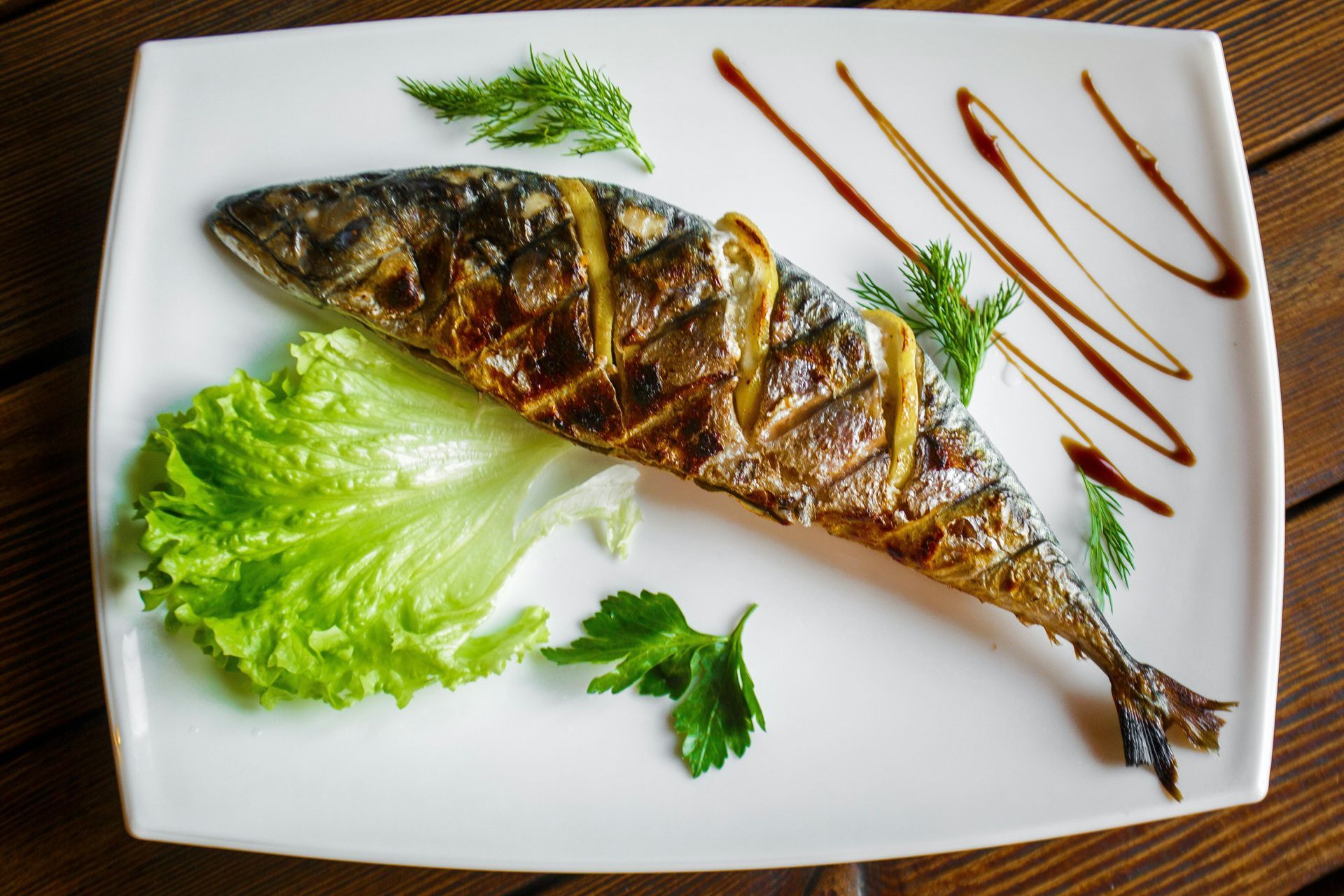 A grilled fish on a plate