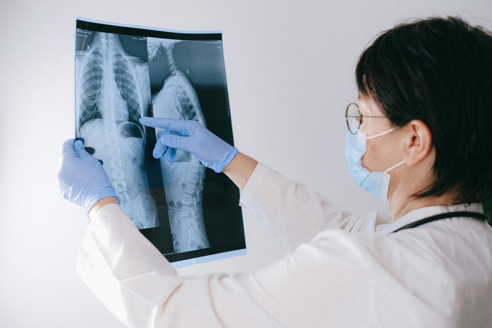 A doctor examining a medical scan.