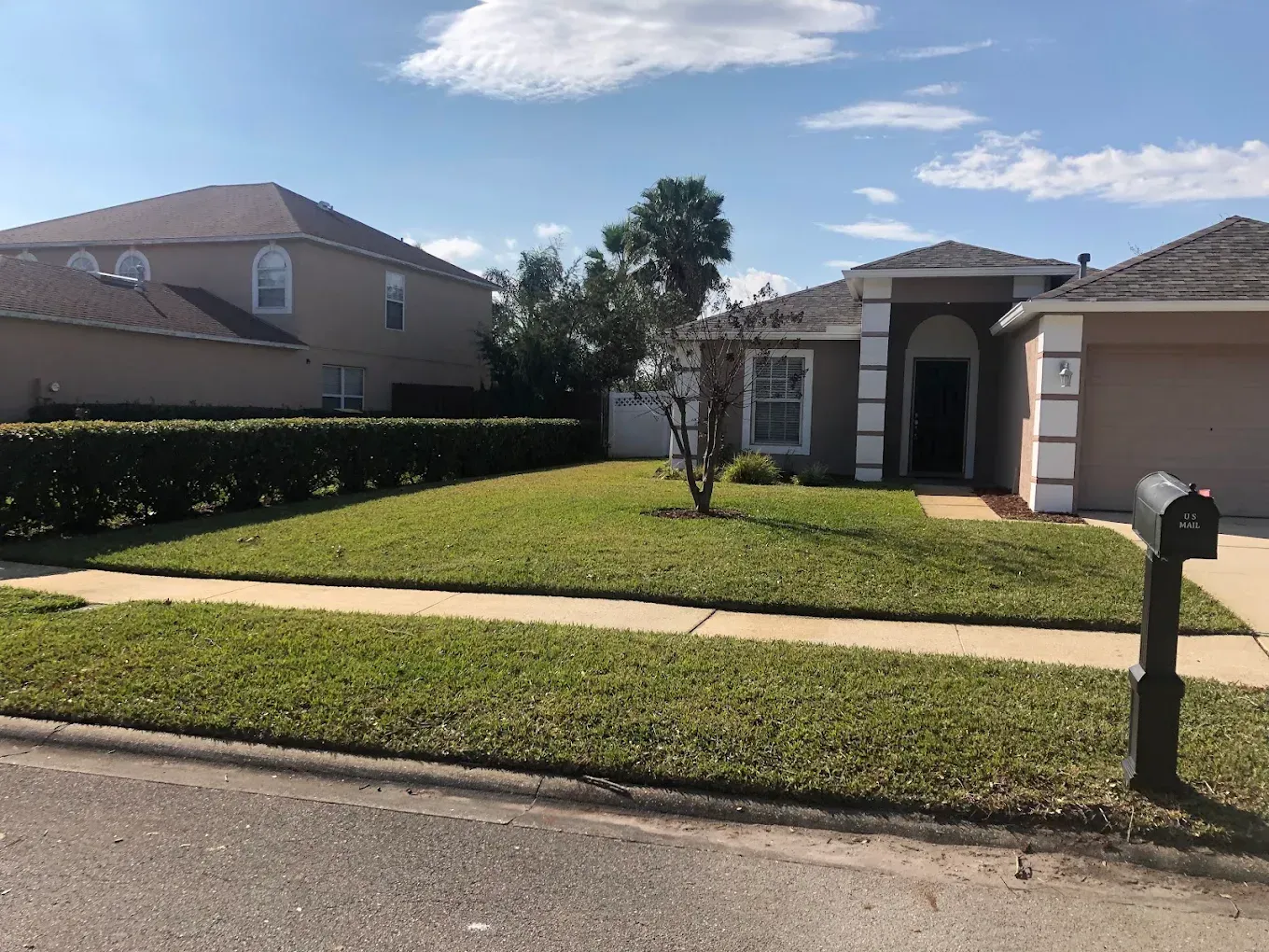 A house with a mailbox in front of it
