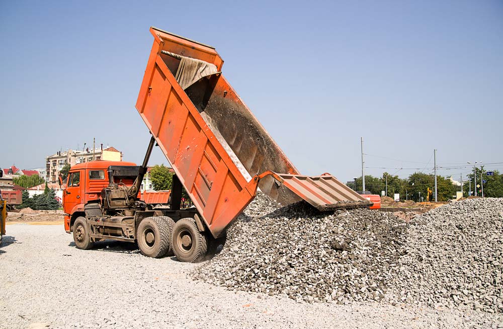 Truck Pours Pile Of Gravel — Tipper Truck Hire In Port Macquarie, NSW