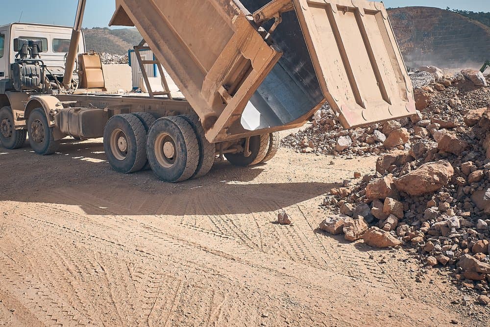 Tipper Truck Unloading Rocks — Tipper Truck Hire In Port Macquarie, NSW