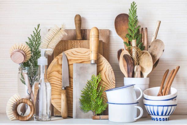 A shelf filled with a variety of kitchen utensils and plates.
