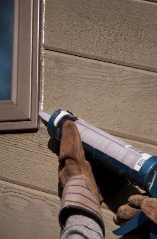 Handyman Surrey Applying new caulking to exterior window edge