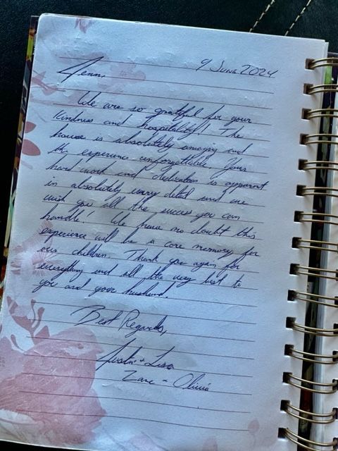 A notebook with a letter written in cursive on it