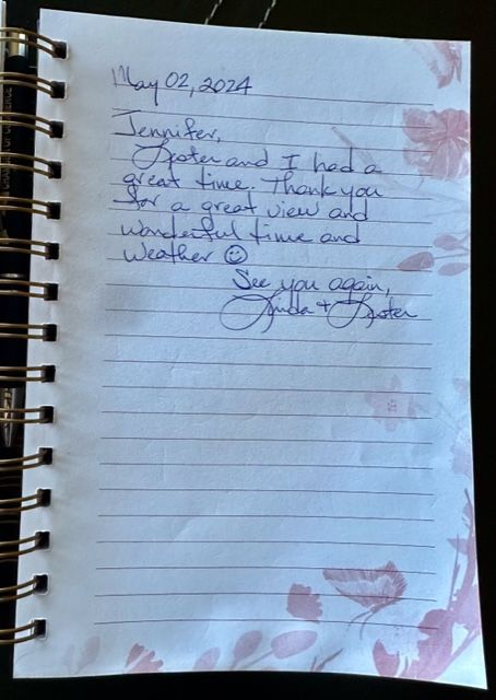 A notebook is open to a note from jennifer