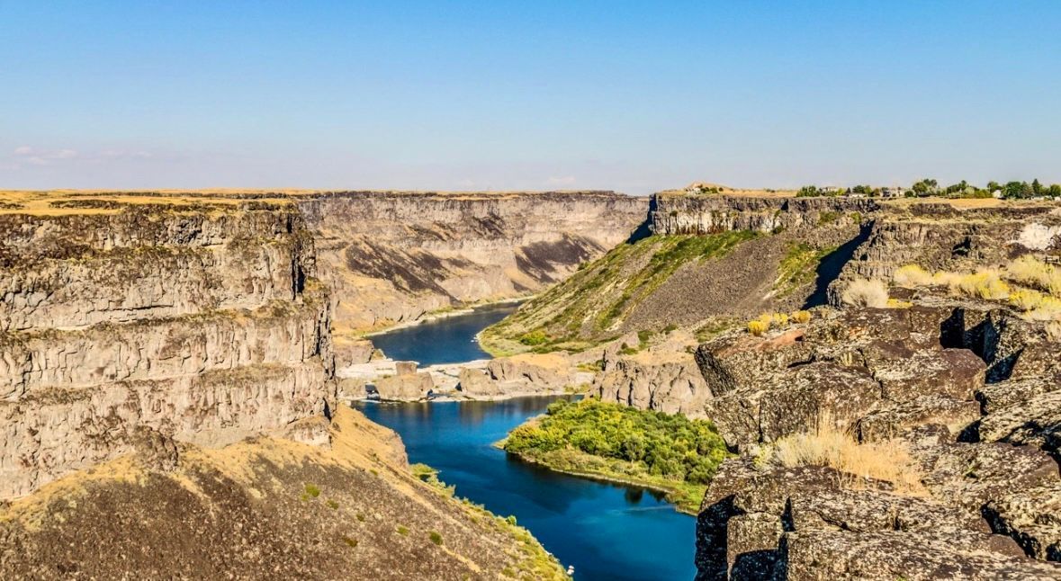An aerial view of a river flowing through a canyon.