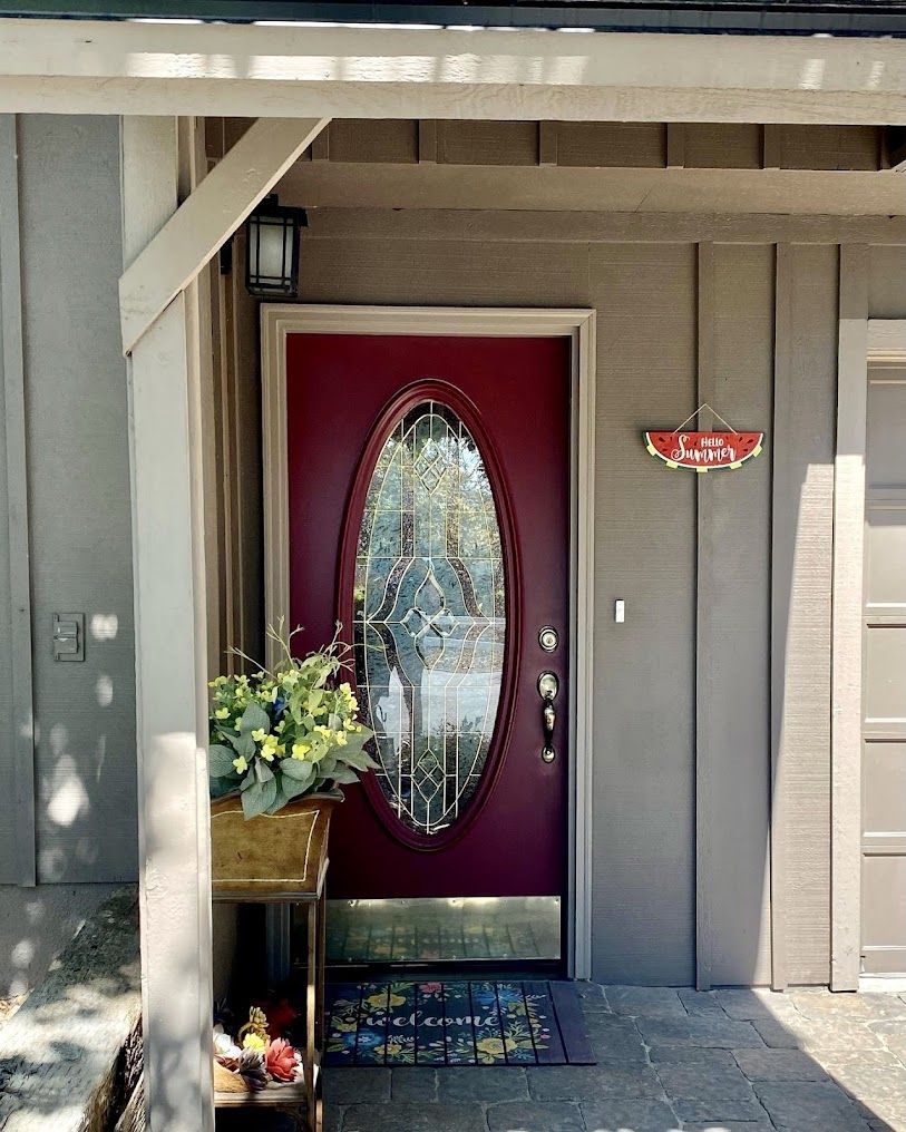 A red door with a sign that says family on it