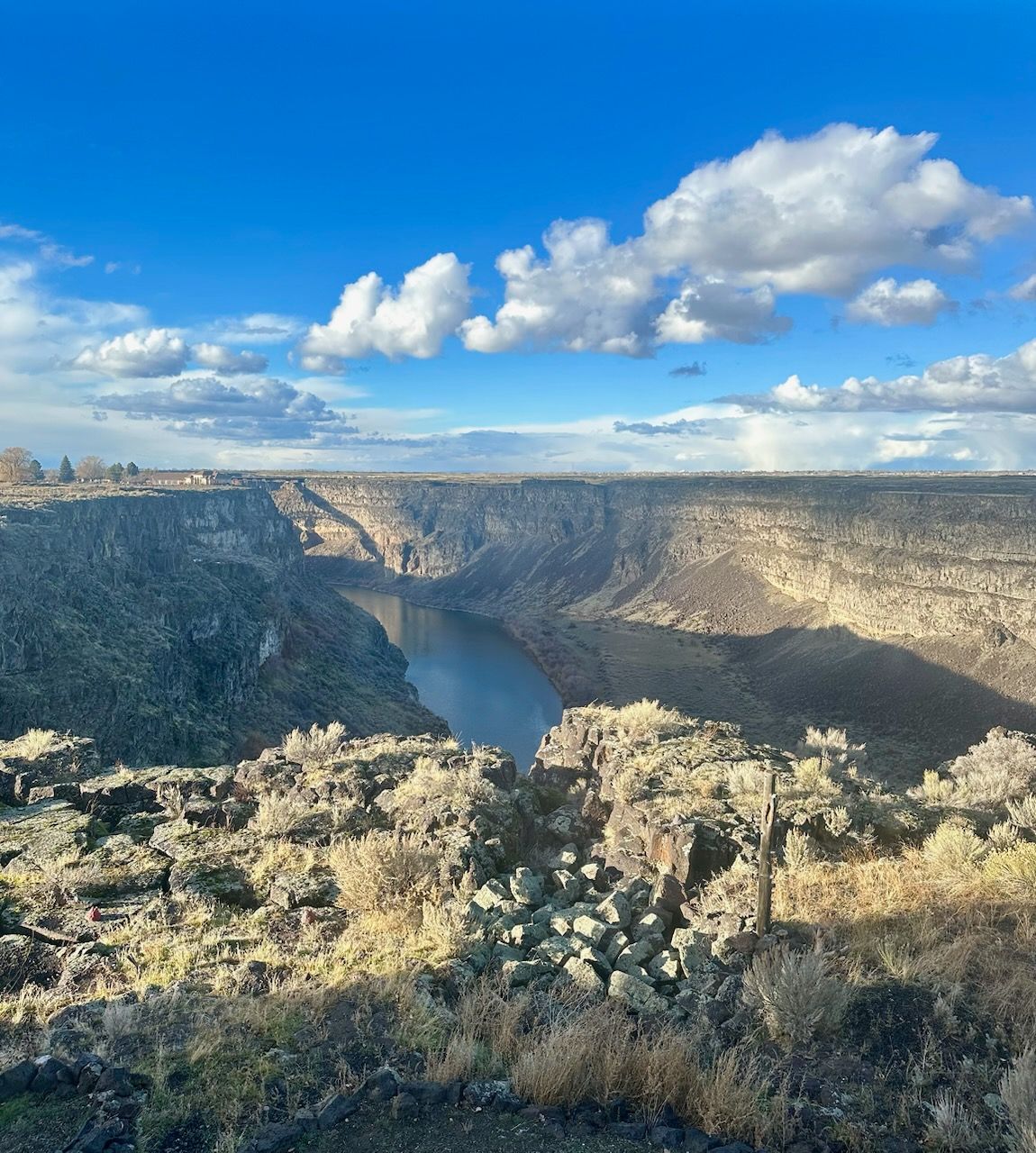 A view of a canyon with a river running through it