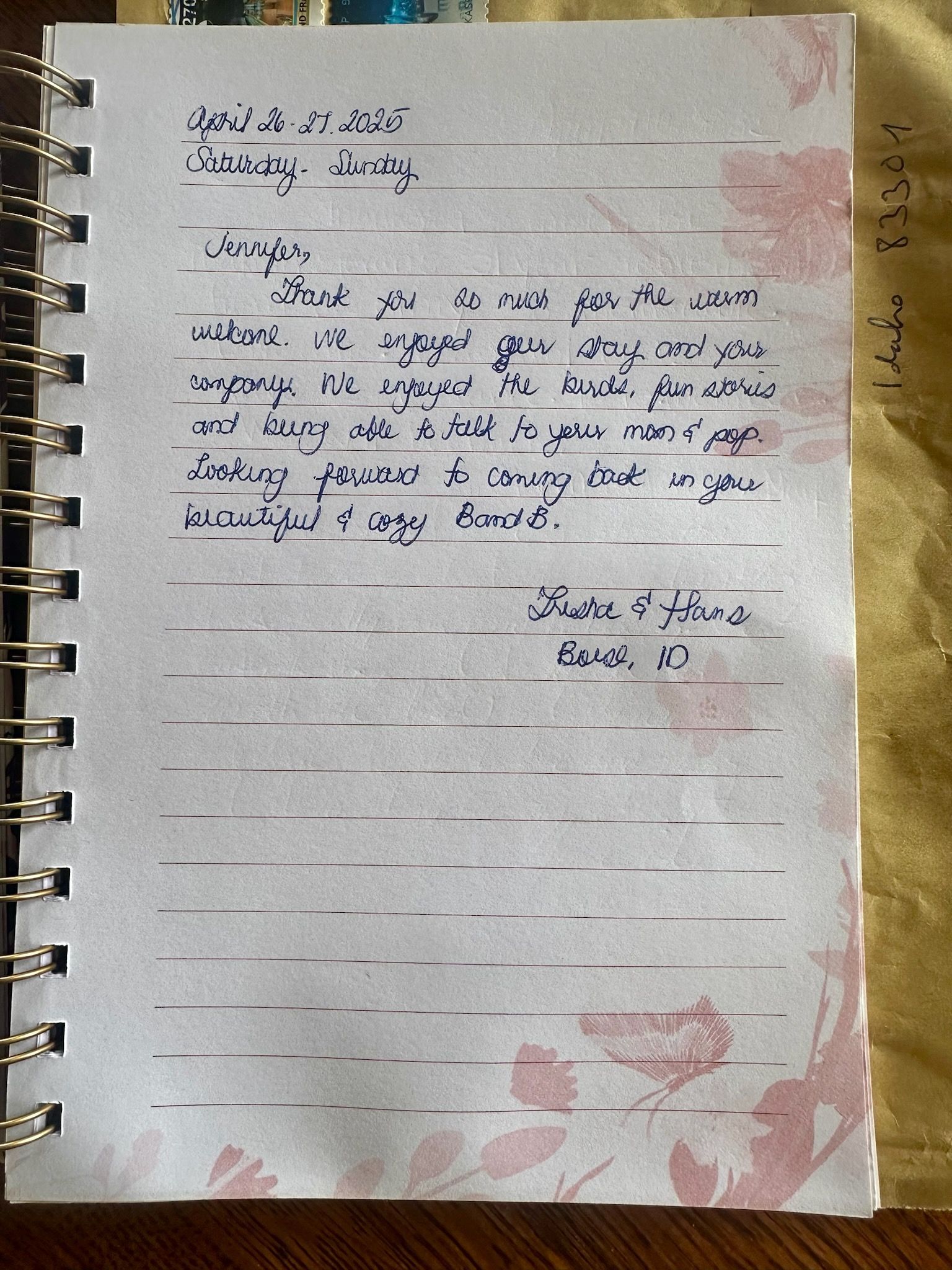 Handwritten letter on floral paper in a spiral notebook; the text includes date, greeting, and gratitude.
