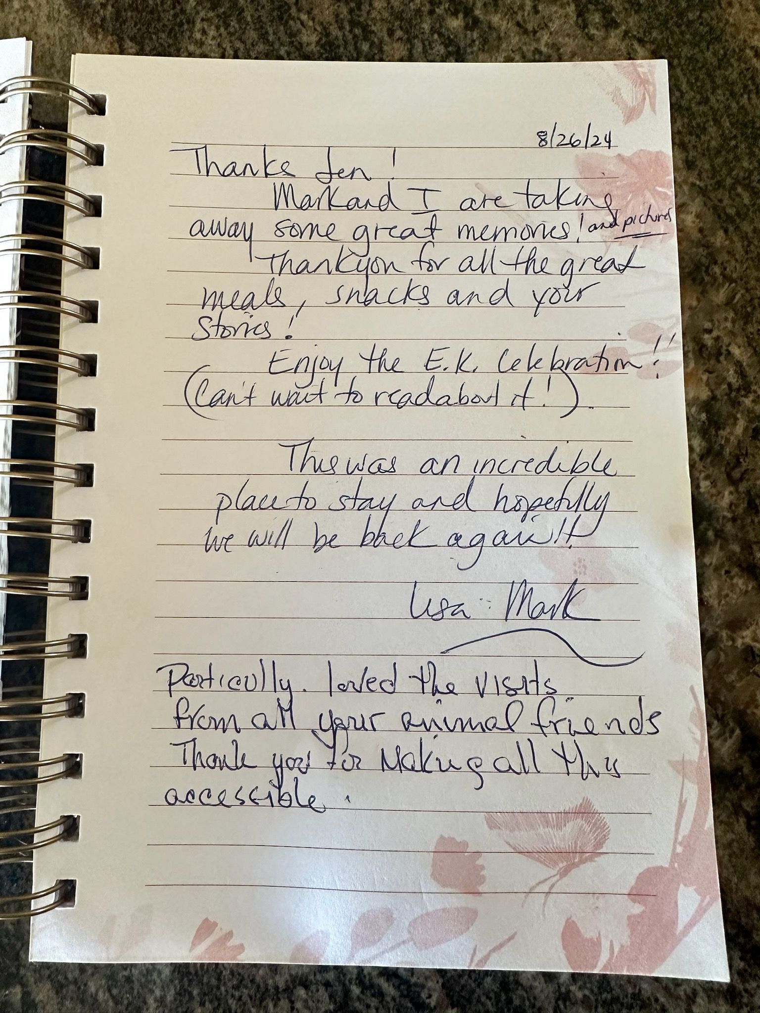 Handwritten note in a spiral notebook, with ink on lined paper; floral design on the right.