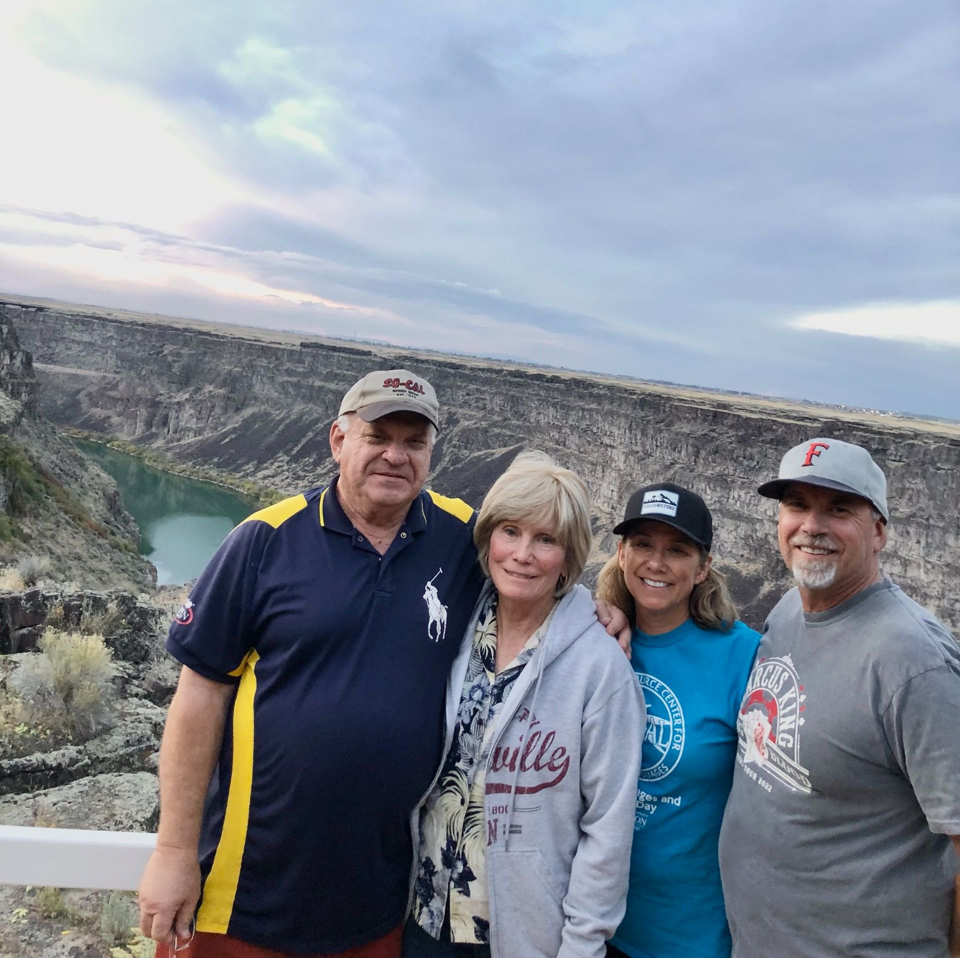 A group of people posing for a picture with one wearing a shirt that says bulls