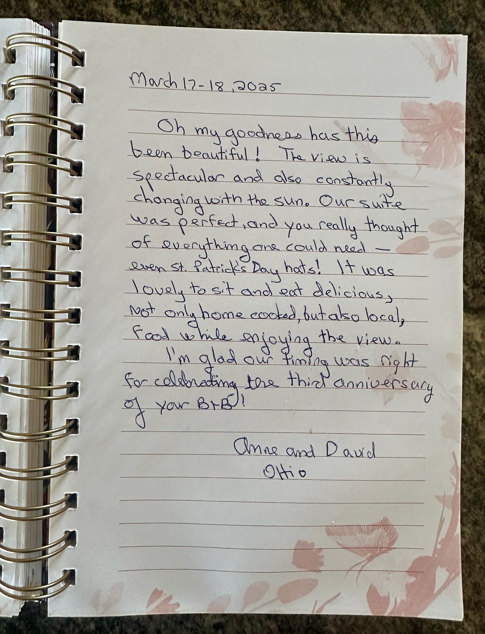 Handwritten journal entry on spiral notebook page, with floral design.