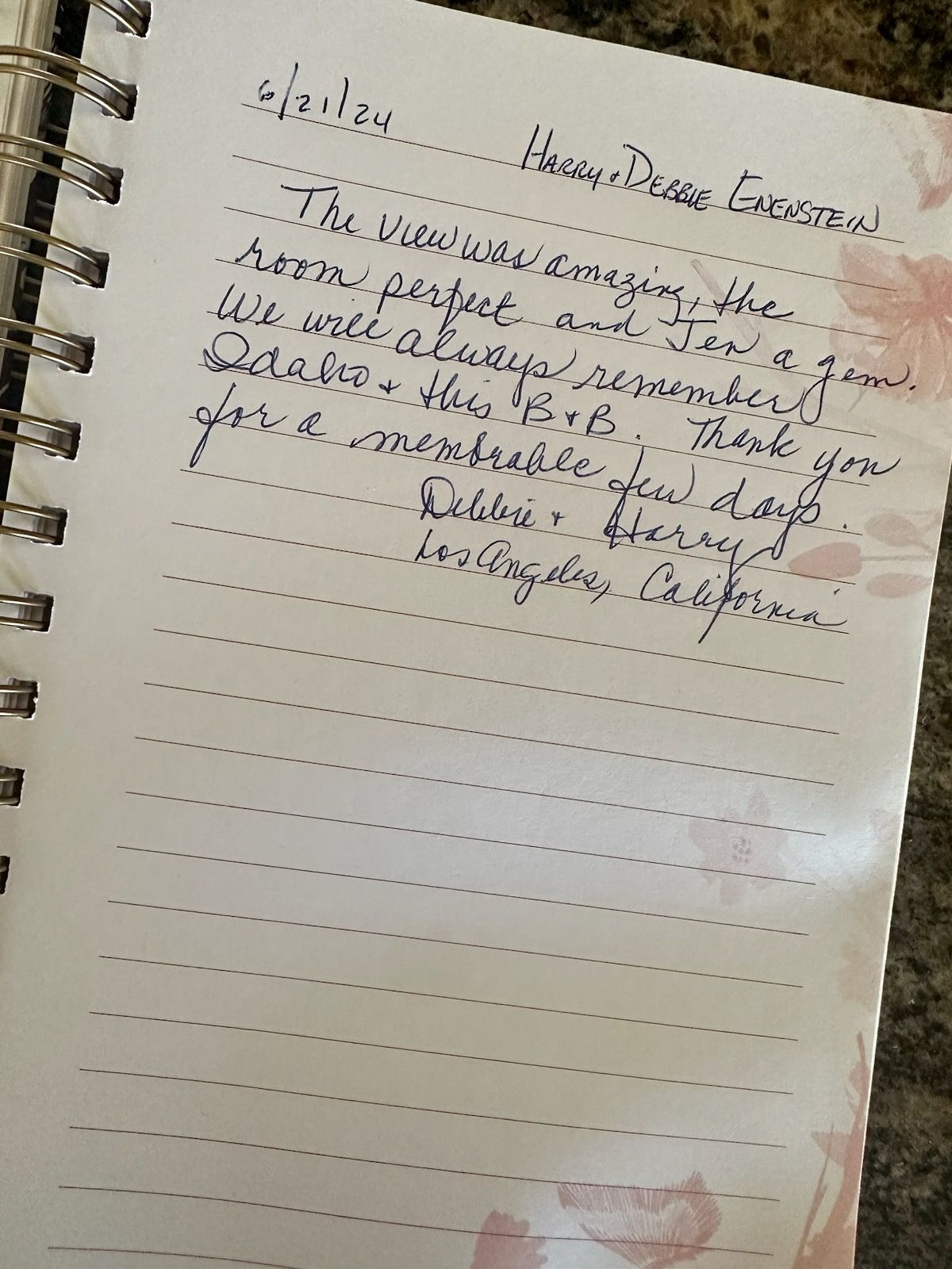 A spiral bound notebook with handwritten notes on it