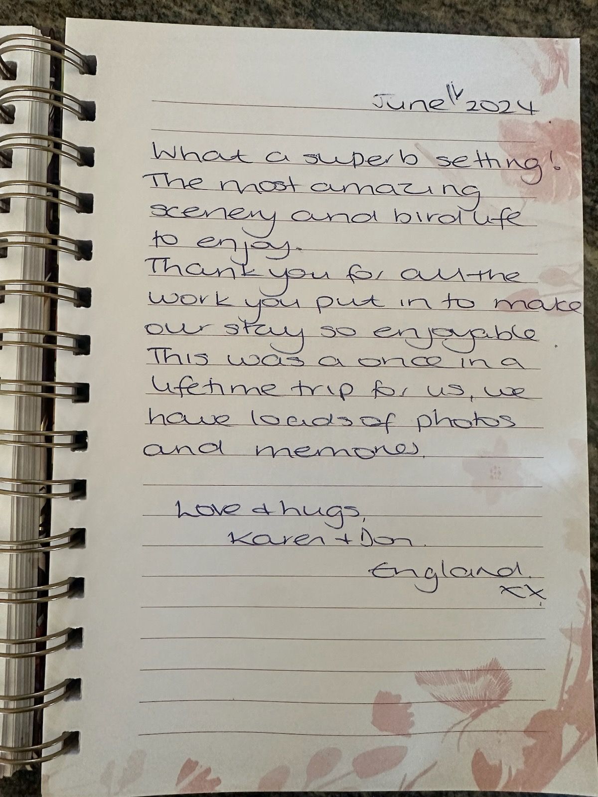 A spiral bound notebook with handwritten notes on it