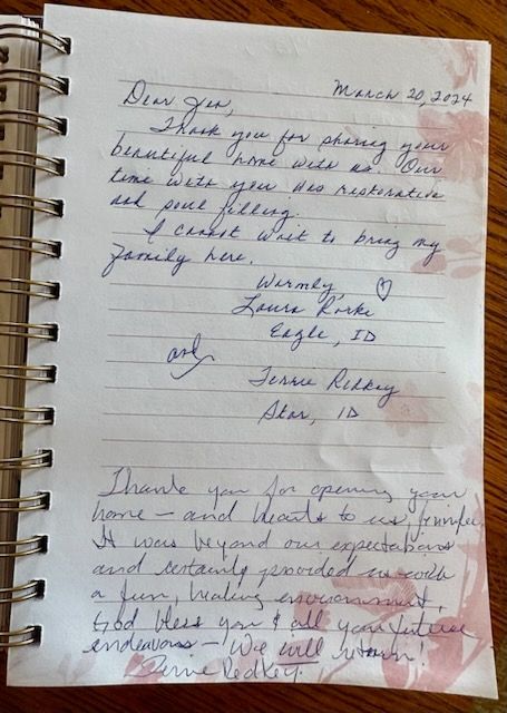 A notebook with a letter written in cursive on it