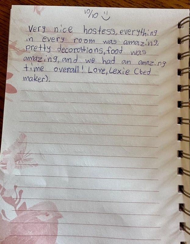 A notebook is open to a page that says very nice hostess everything in every room was amazing