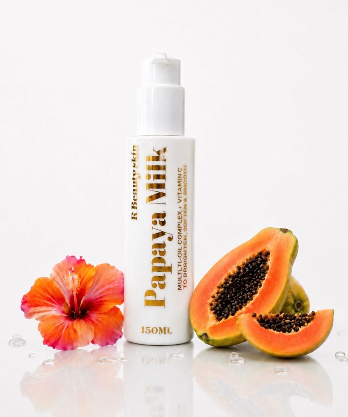Flesje Papaya Vita huidverzorging met papajaschijfjes en een hibiscusbloem op een witte achtergrond.
