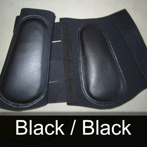 A pair of black knee pads with the words black / black below them