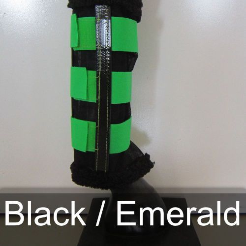 A pair of black and green leg wraps that say black / emerald