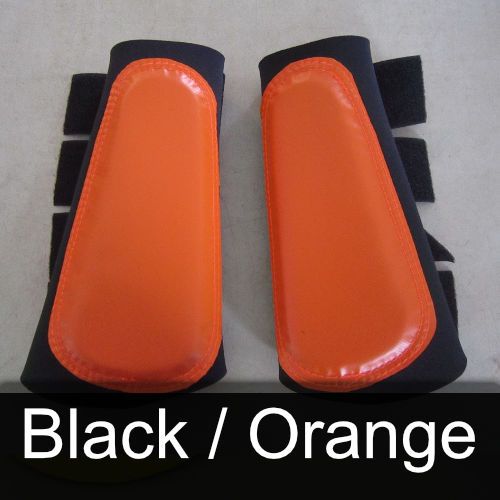 A pair of black and orange leg protectors