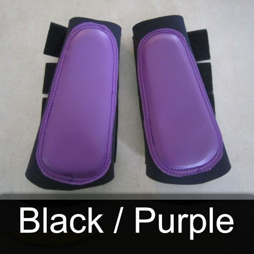 A pair of black and purple boots on a table