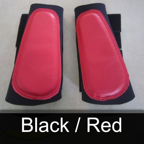 A pair of black and red boots are sitting on a table