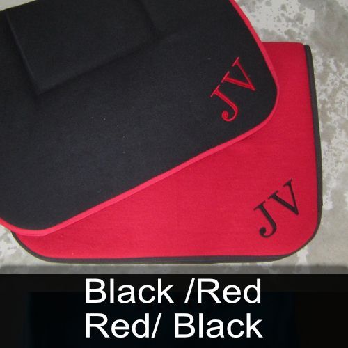 A black and red mat with the letters jv on it