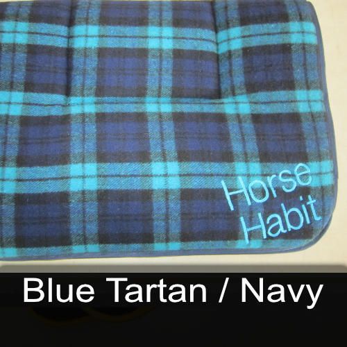 A blue plaid blanket with the words horse habit embroidered on it