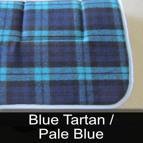 A blue plaid blanket with the words blue tartan / pale blue below it