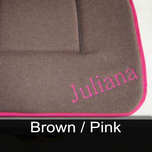 A brown and pink cushion with the name juliana embroidered on it
