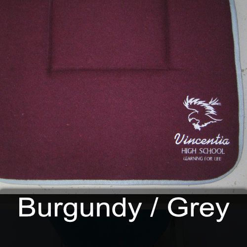 A burgundy and grey saddle pad for vincentia high school