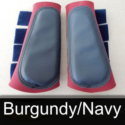 A pair of burgundy and navy boots on a table