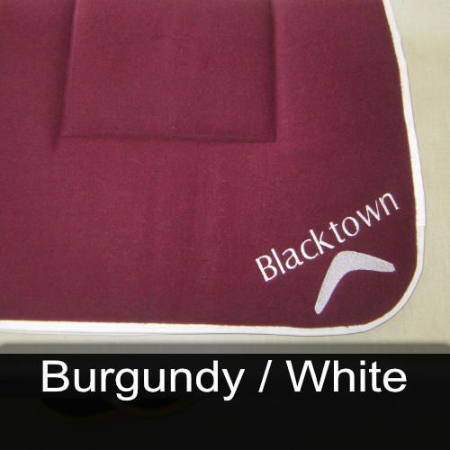 Burgundy and white saddle pad with blacktown written on it