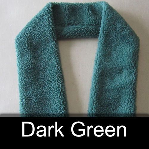 A dark green scarf is sitting on a white surface