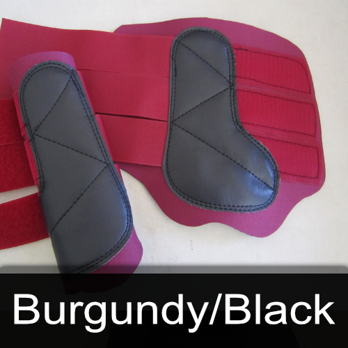 A pair of burgundy and black boots on a table