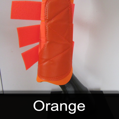 A pair of orange boots on a mannequin