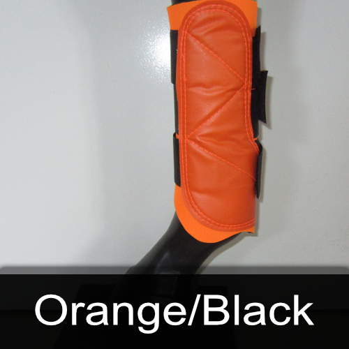 A pair of orange and black boots on a mannequin