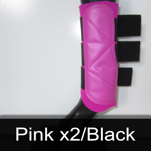 A pair of pink x2 / black boots on a mannequin