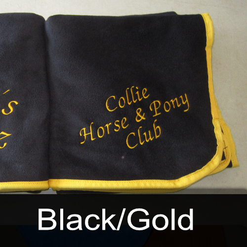 A black and gold blanket that says collie horse & pony club