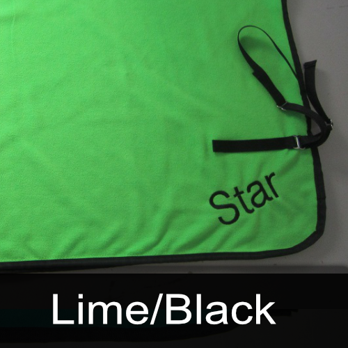 A green blanket with the name star embroidered on it
