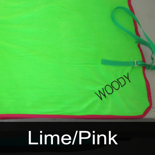 A neon green towel with the name woody embroidered on it
