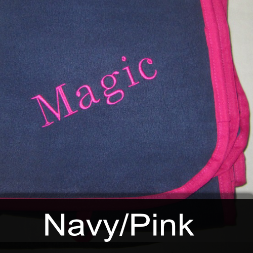 A blanket with the name magic embroidered on it