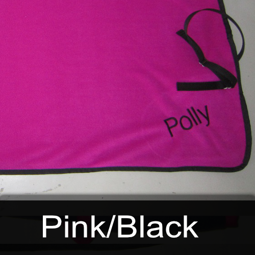 A pink blanket with the name polly embroidered on it