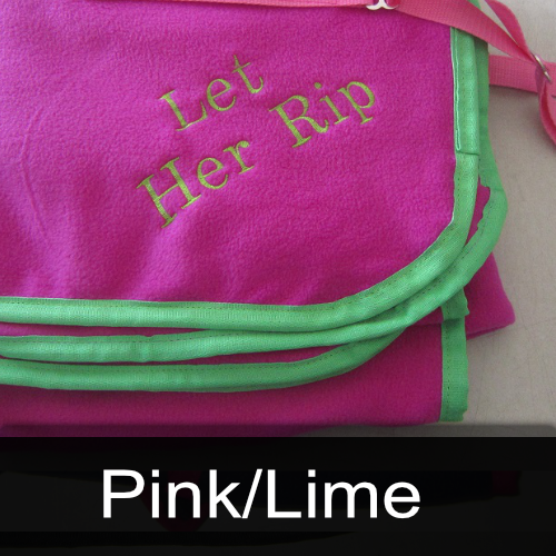 A pink blanket with the words let her rip embroidered on it