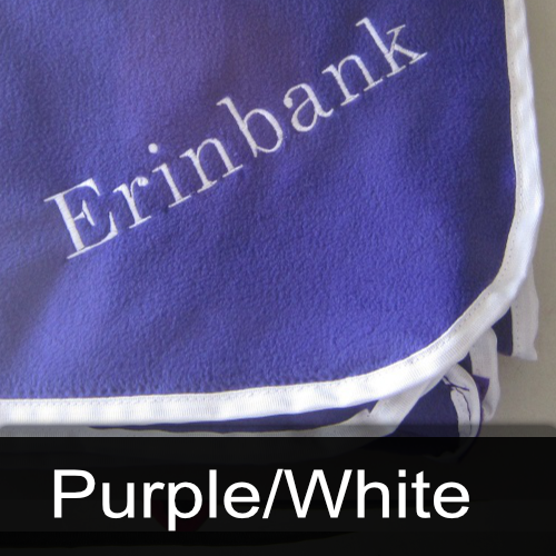 A purple blanket with the name erinbank embroidered on it