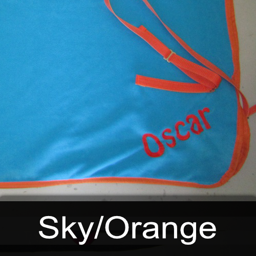 A blue cloth with the name oscar embroidered on it