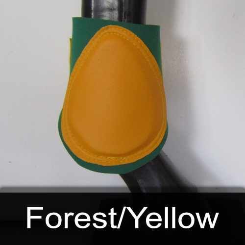 A horse 's leg with a yellow and green boot on it.