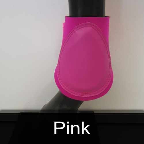 A close up of a pink boot on a horse 's leg.